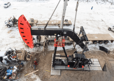 A large oil pump actively extracting oil from the ground, showcasing industrial energy production in action.
